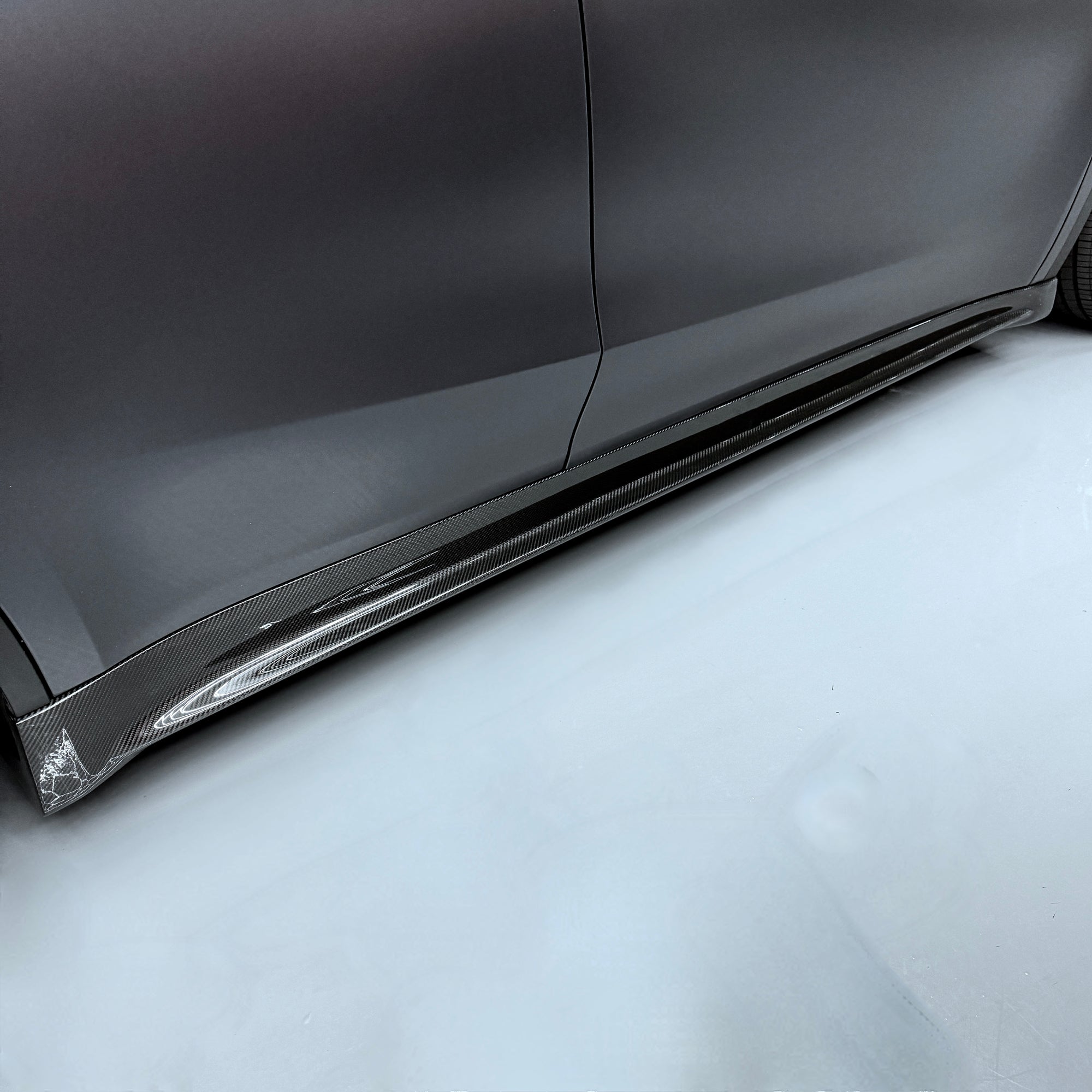 2020+ | Model Y Colossal Side Skirt Overlays - Real Dry Molded Carbon Fiber